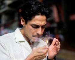 Carlos Miranda smoking